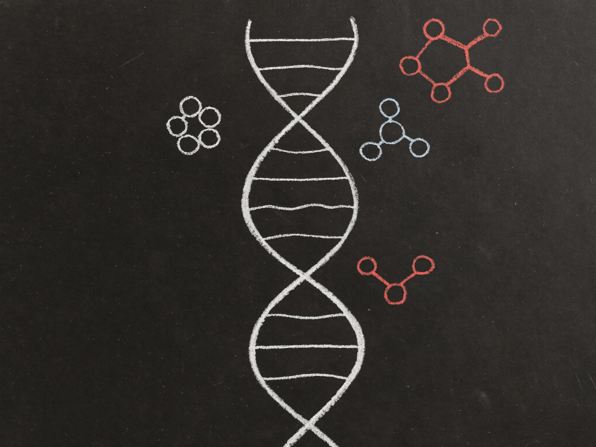 White chalk-style icons of DNA, a microscope, and other research-related imagery on a dark background.